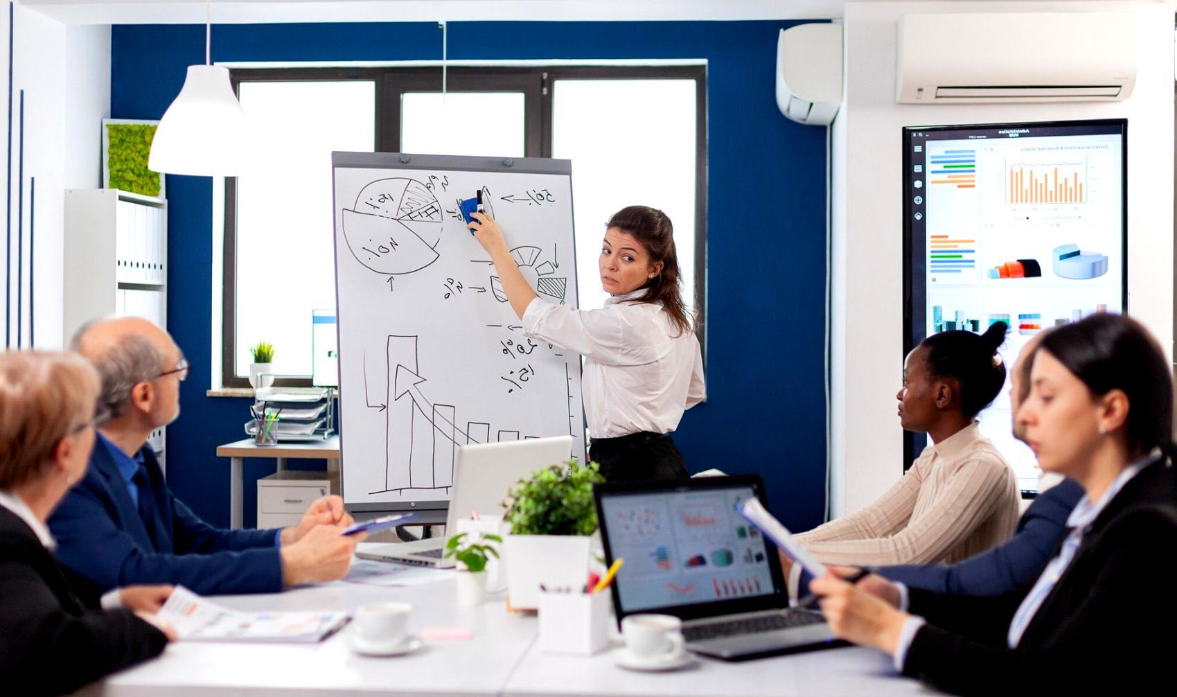 Technical training session with cloud infrastructure monitoring displays